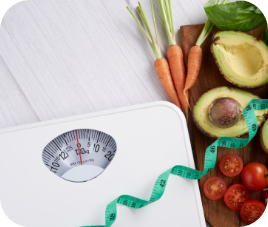 scale, vegetables, fruits and measuring tape for weight loss plan