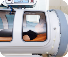 person increasing oxygen delivery inside a pressure chamber