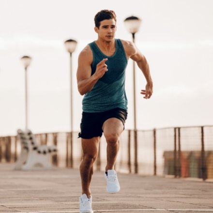 strong man running showing how low testosterone treatment program restored vitality.