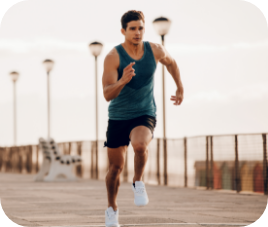 strong man running showing how low testosterone treatment program restored vitality.